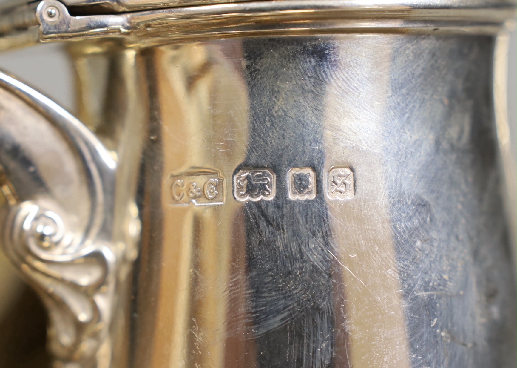 A George V silver coffee pot, London, Carrington & Co 1933, an earlier silver mug by Elkington & Co, a silver sugar caster, cream jug and sugar bowl, a repousse box, pair of silver mounted opera glasses and two plated fr